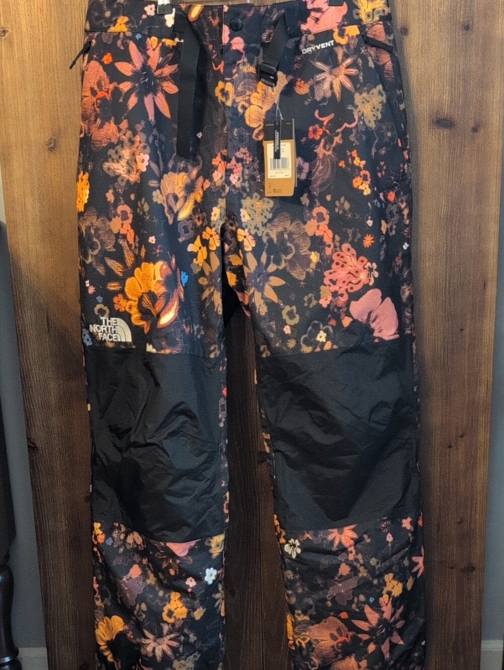 The North Face Black Floral Men's Snow Pants with Orange and Pink Accents